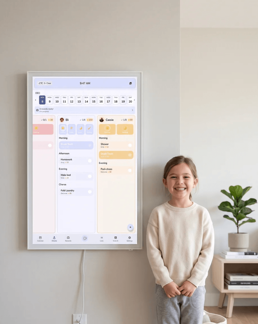 Child standing beside a Kora display showing chores